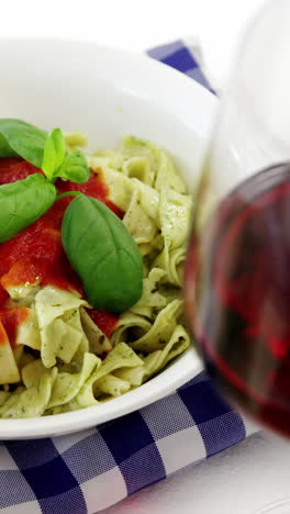 Glass-of-red-wine-with-cooked-pasta