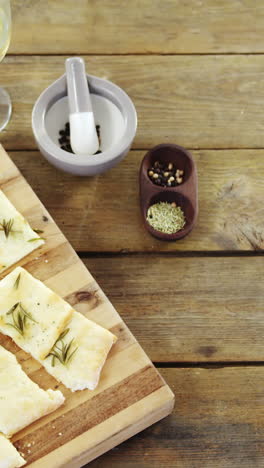 Snacks-on-tray-with-glasses-of-wine-and-wine-bottle