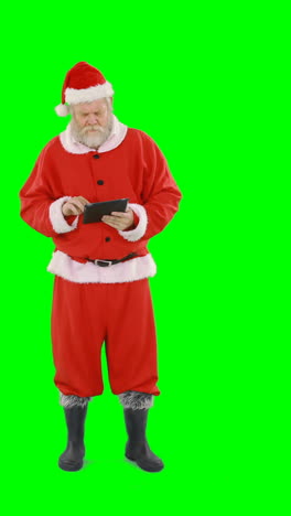 Santa-claus-using-digital-tablet