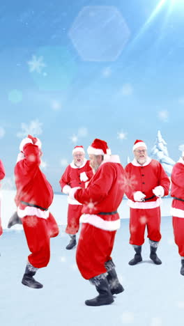 Group-of-santa-claus-dancing-on-a-snowy-landscape