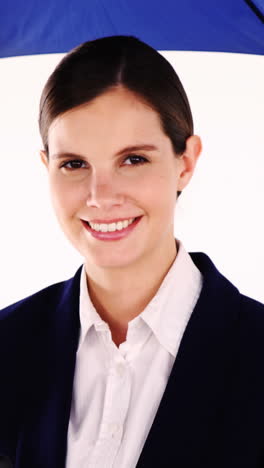 Businesswoman-holding-umbrella-and-clipboard