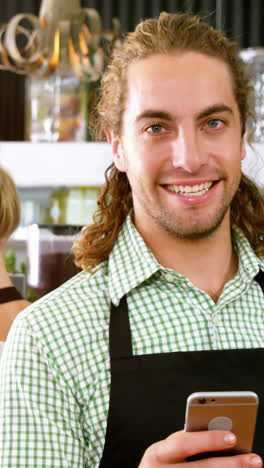 Waiter-using-mobile-phone