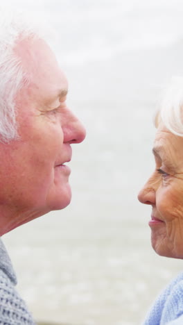 Senior-man-kissing-senior-woman-on-forehead