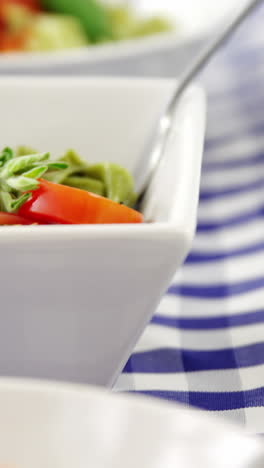 Three-bowls-of-cooked-pastas-with-forks