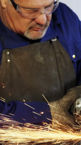 Welder-working-at-work-shop