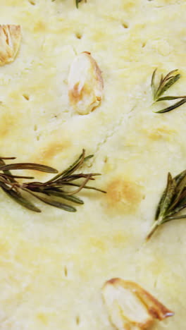 Garlic-bread-with-oil-on-wooden-board