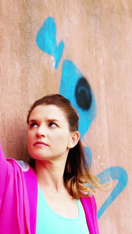 Dancer-leaning-against-wall-outside-dance-studio