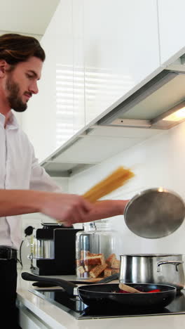 Man-preparing-a-food-in-kitchen