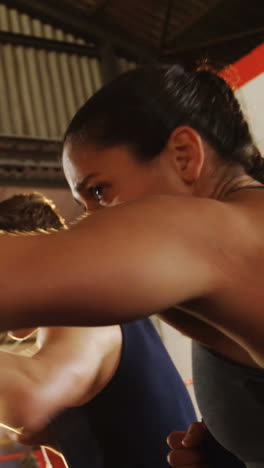 Two-boxers-practicing-in-boxing-ring