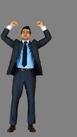 Handsome-businessman-with-arms-up