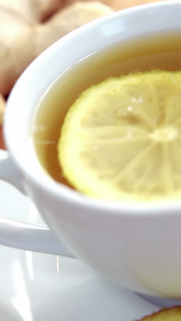 Lemon-tea-with-lemon,-sliced-ginger-and-herb