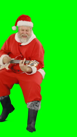 Santa-claus-holding-inflatable-tube-and-cocktail