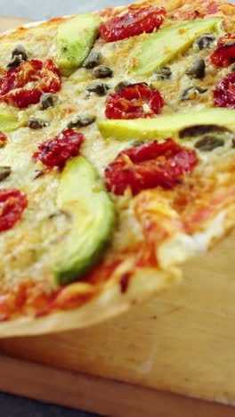 Baked-pizza-served-on-wooden-board