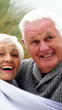 Happy-senior-couple-pointing-at-view