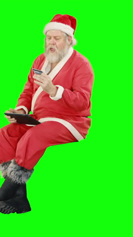 Santa-claus-doing-christmas-shopping-online