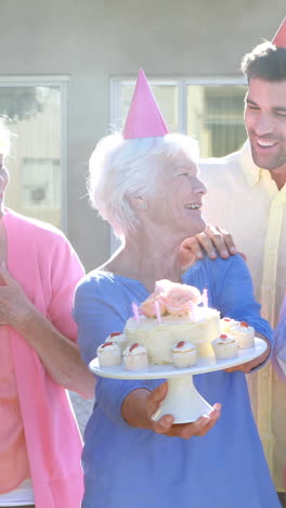 Doctors-and-senior-citizen-celebrating-birthday