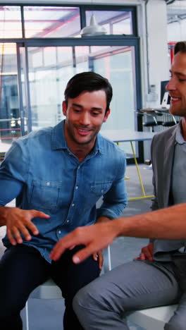 Group-of-happy-business-executives-with-hand-stack-