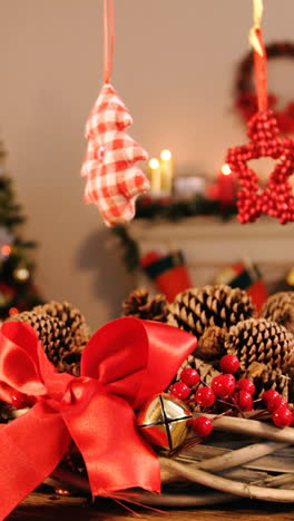 Grapevine-wreath-with-red-ribbon-and-pine-cone