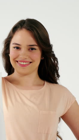 Portrait-of-smiling-woman-holding-a-shopping-bag