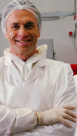 Team-of-smiling-butcher-standing-with-arms-crossed