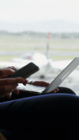 Passengers-using-laptop-and-mobile-phone