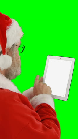 Santa-claus-using-digital-tablet