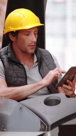 Male-warehouse-worker-using-digital-tablet