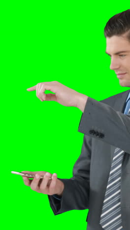 Young-businessman-gesturing-while-using-mobile-phone