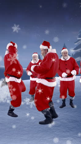 Group-of-santa-claus-dancing-on-a-snowy-landscape