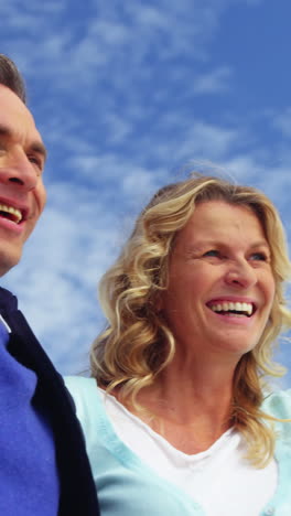 Mature-couple-enjoying-on-beach