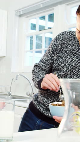 Father-and-son-having-a-breakfast-in-kitchen