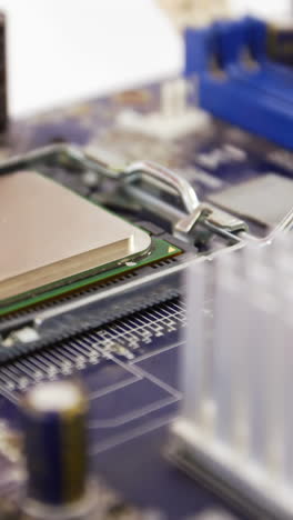 Technician-fixing-chip-on-motherboard