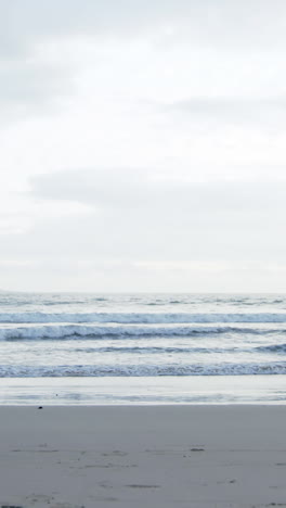 Mature-couple-jogging-on-beach