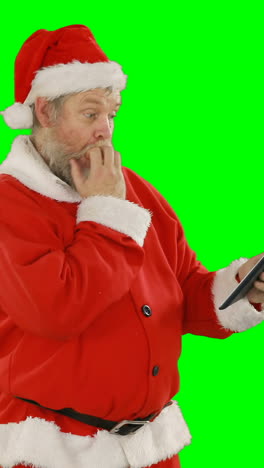 Santa-claus-using-digital-tablet