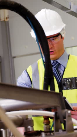 Inspection-officers-writing-on-clipboard