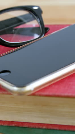 Mobile-phone-with-spectacles-and-book