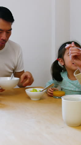 Happy-family-having-breakfast