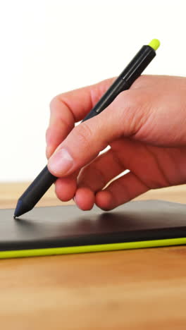 Hand-of-graphic-designer-using-graphic-tablet