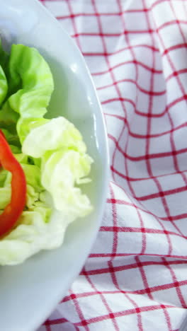 Salad-with-wine-on-wooden-table