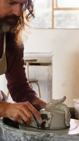 Male-potter-making-pot