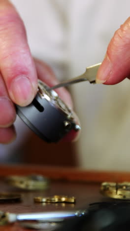 Close-up-of-horologist-repairing-a-watch