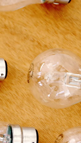 Light-bulbs-on-wooden-table