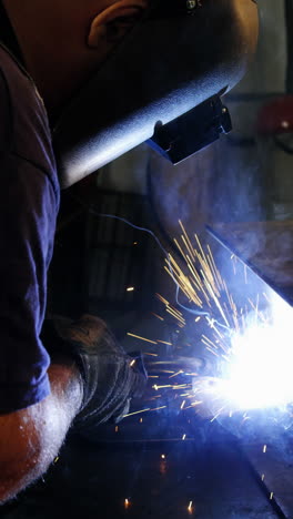 Welder-welding-a-metal