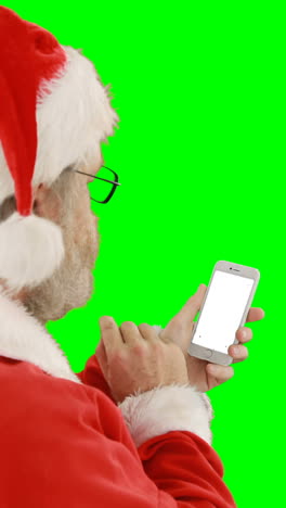 Weihnachtsmann-Benutzt-Mobiltelefon