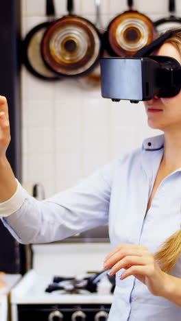 Woman-using-virtual-reality-headset-in-kitchen