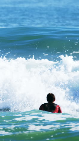 Surfers-surfing-in-sea