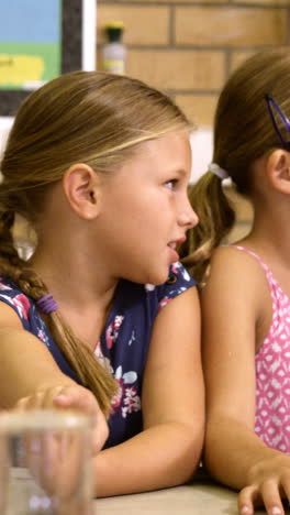 School-kids-interacting-with-each-other-in-laboratory