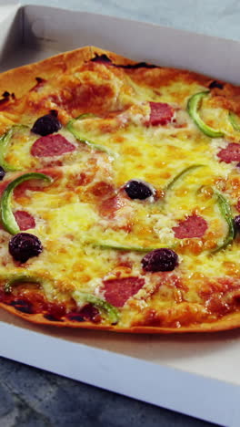 Baked-pizza-with-olive-and-peperoni-toppings