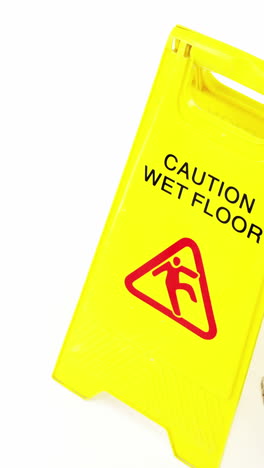 Mop-with-wet-floor-caution-sign