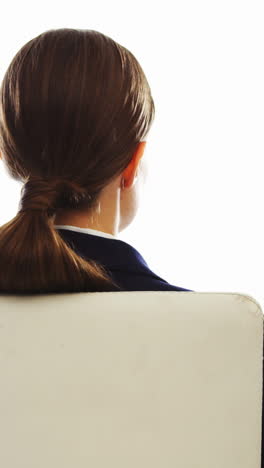 Businesswoman-sitting-and-smoking-cigar